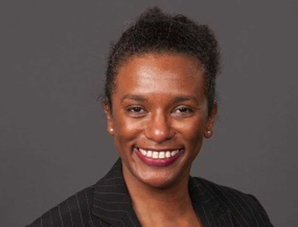 A headshot of Pamela Meadows in front of a charcoal grey backdrop