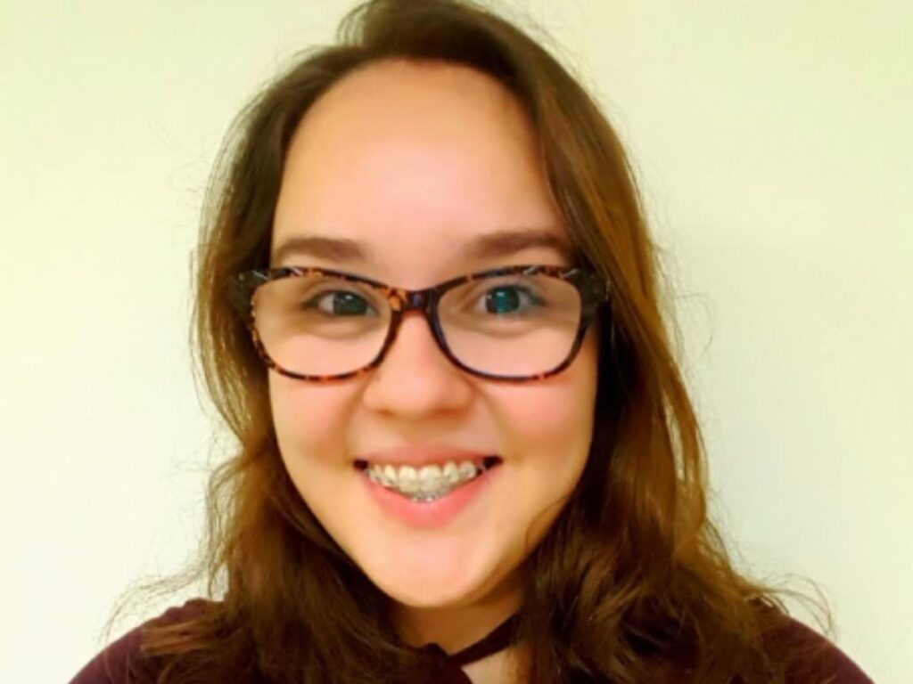 A headshot of Jasmin Preciado, smiling