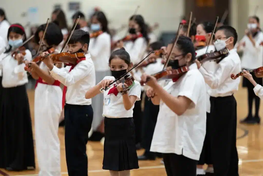 young string students performing