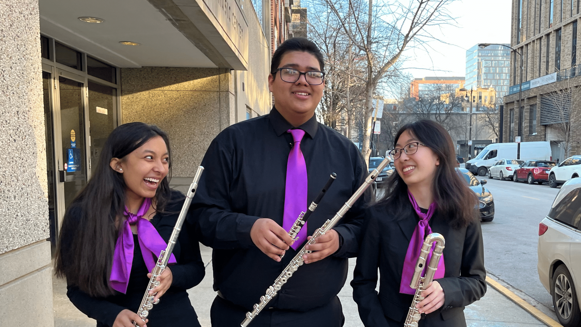 Members of the Purple Hippopotami chamber ensemble pose with their flutes.
