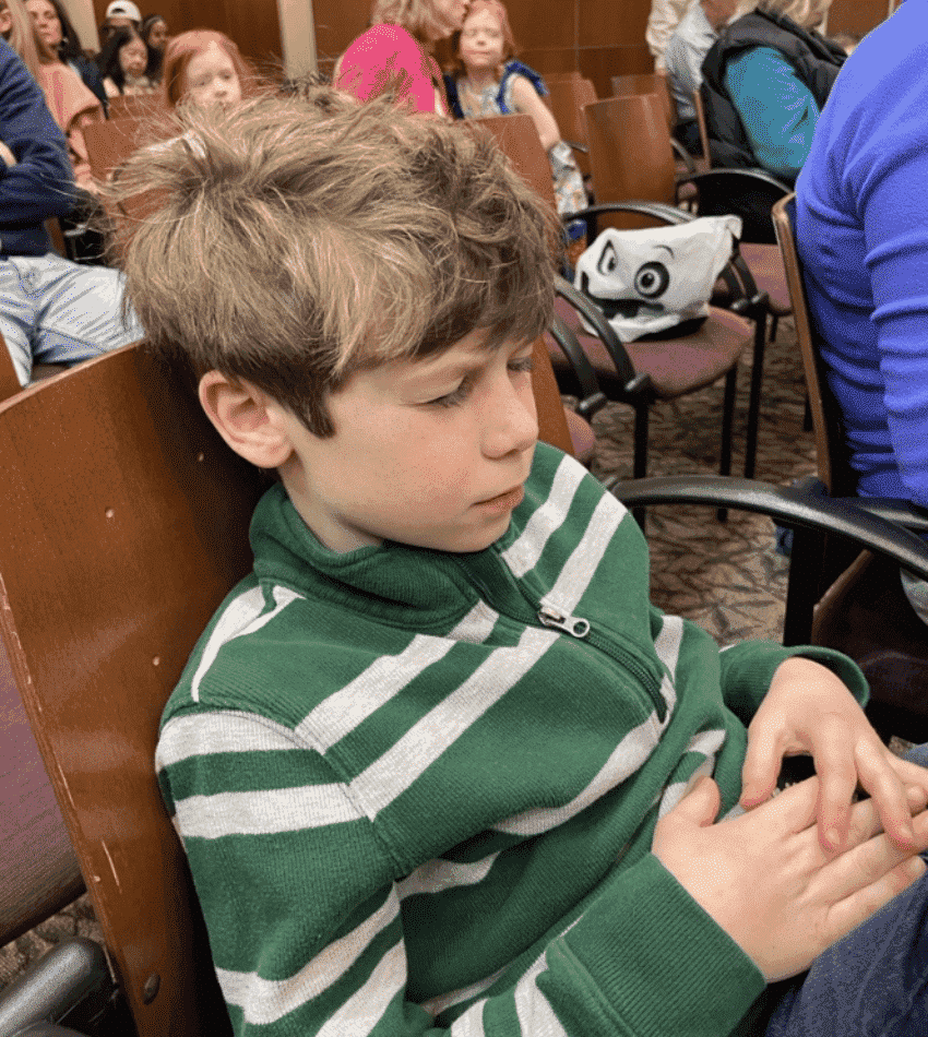 A child appreciates the music with his eyes closed at last year's Sensory/Family-Friendly Concert.