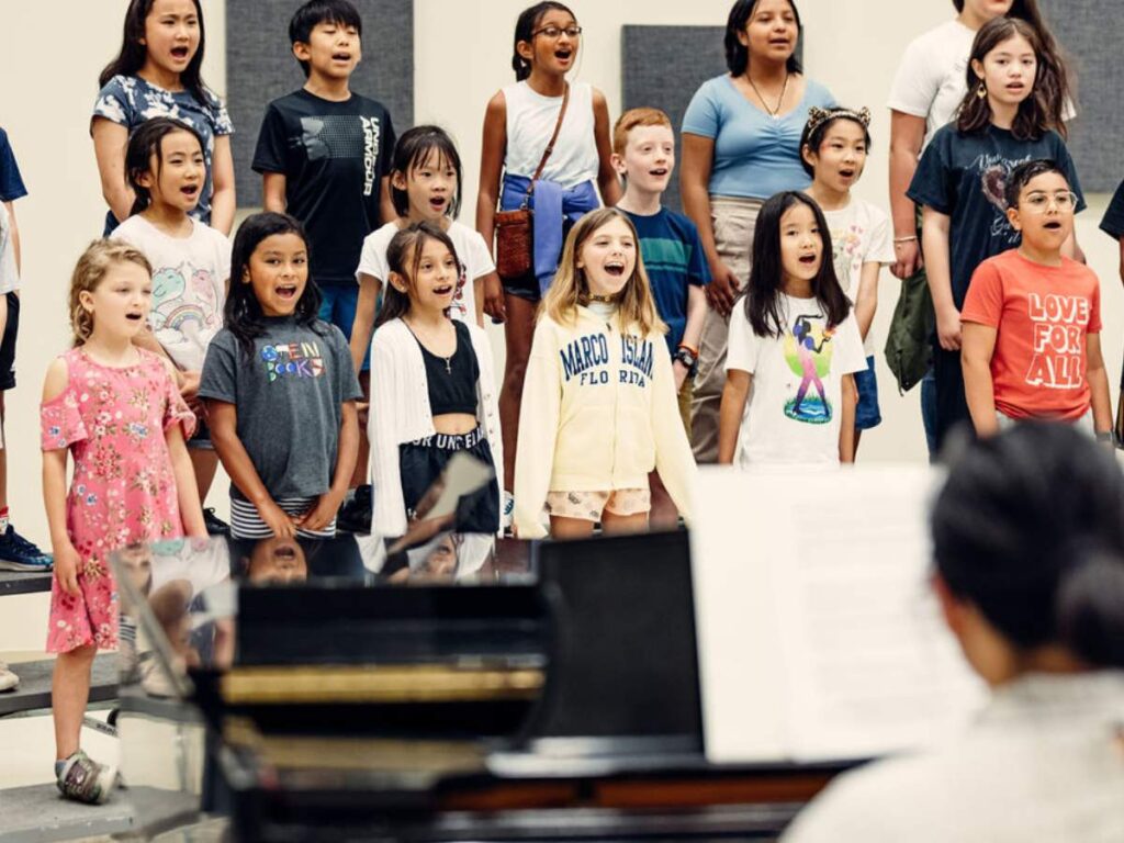 Choir camp students sing together as a group
