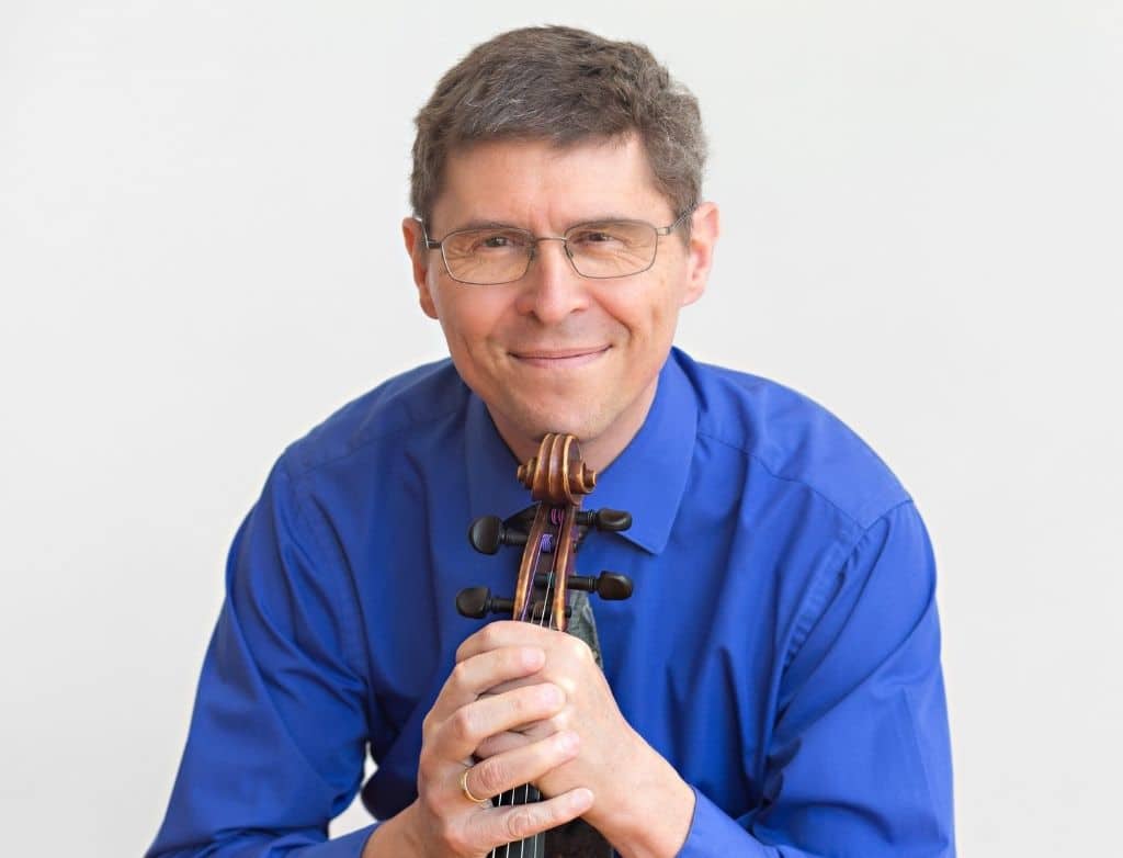 Peter Slowik holding a viola