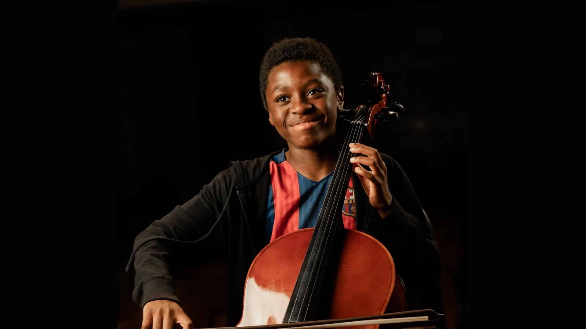 A boy playing cello