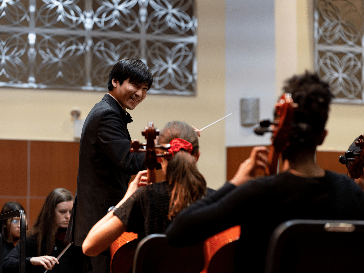 Taichi conducting a concert in Gottlieb Hall.