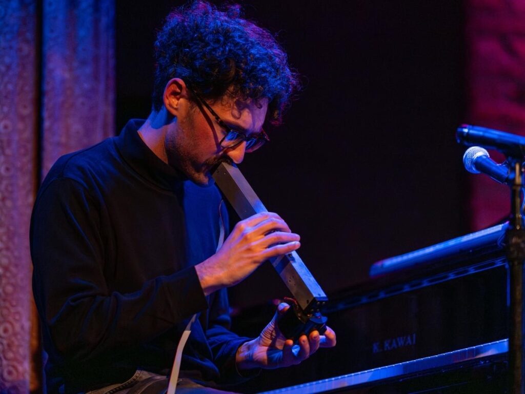 Will Miller playing an electronic wind instrument
