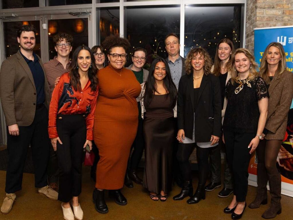 Merit's Associate Board poses together